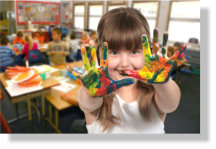 child have a paint on her hands